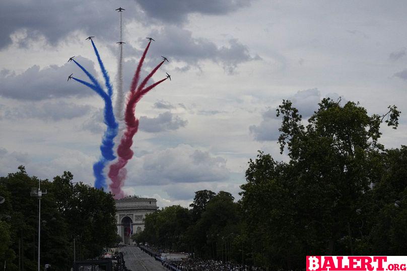 Olympic Flame Shines Bright on Bastille Day in Paris